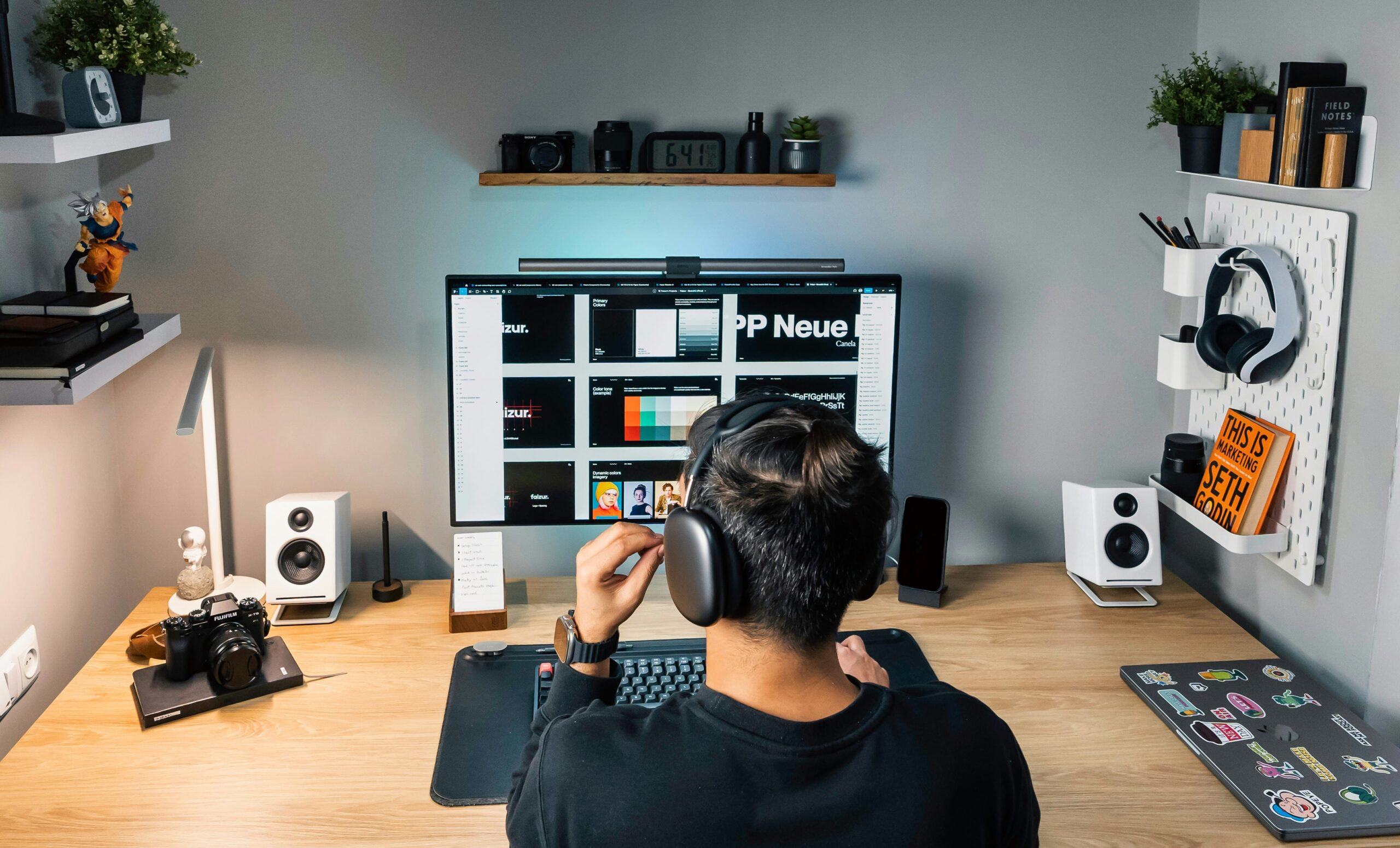 man in black shirt sitting in front of computer